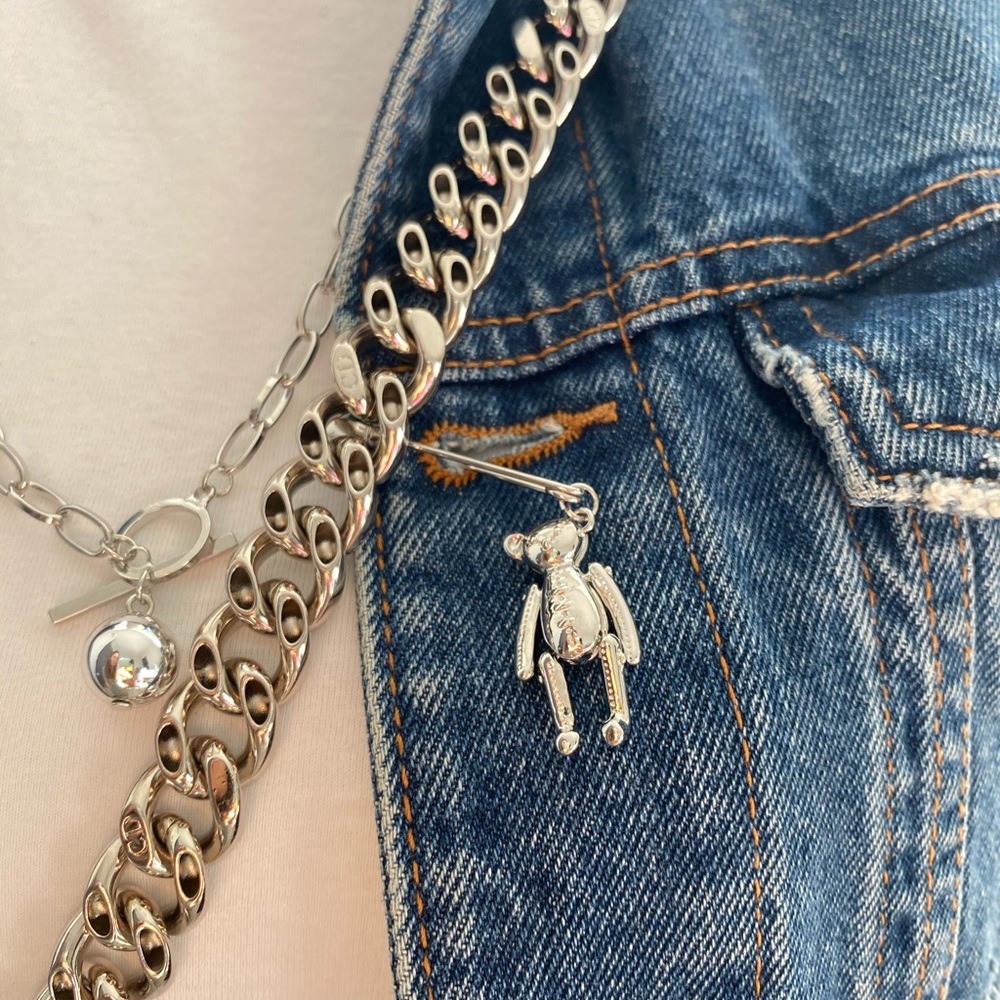 Silver stitched teddy bear pin